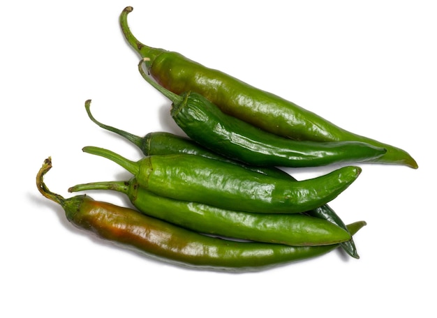 Fresh green chili peppers Spicy vegetable isolate Peppers on a white background Ingredient for dishes The concept of spicy food Fresh chili pepper Harvesting vegetables for seasonings