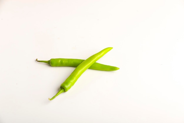 Fresh green chilli on white background