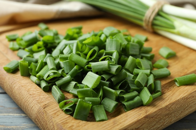 Fresh green chopped onion on cutting board