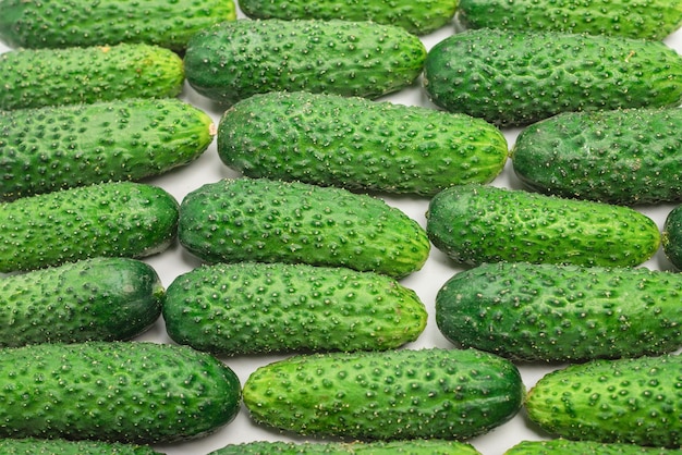 Fresh green cucombers as a background