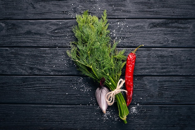 Fresh green dill on a wooden background Top view Free space for your text