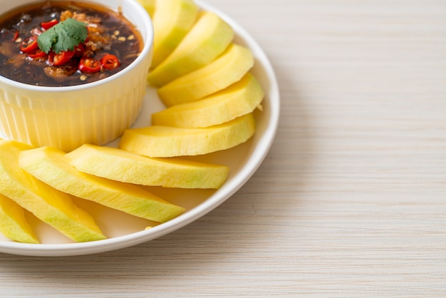 fresh green and golden mango with sweet fish sauce dipping - Asian style