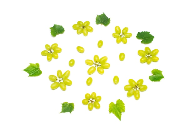 Fresh green grapes branch isolated on white background. Creative concept of fruit, butterfly shape. Flat lay, top view