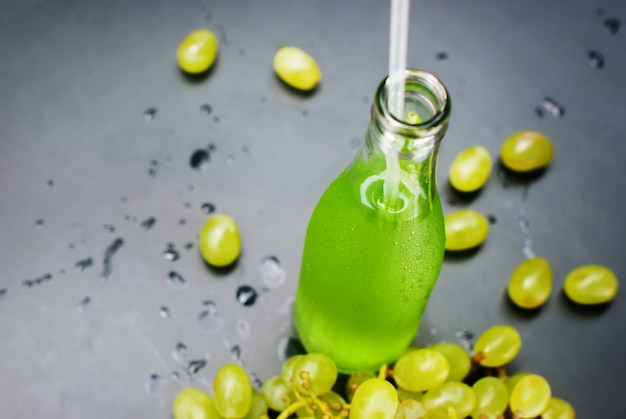 Fresh Green Grapes Juice Bottles Dark Table