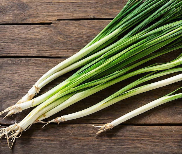 fresh green onion on wooden background