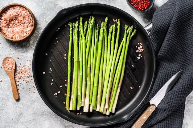 Fresh green organic asparagus in a pan. Top view