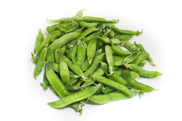 Fresh green pea pods on white background