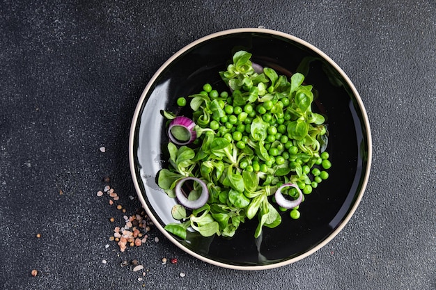 fresh green pea salad mix leaves lettuce meal food snack on the table copy space food background