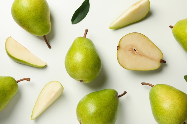 Fresh green pears on white background, top view