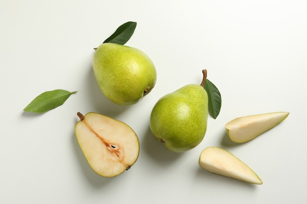 Fresh green pears on white