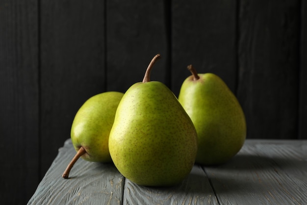 Fresh green pears on wooden