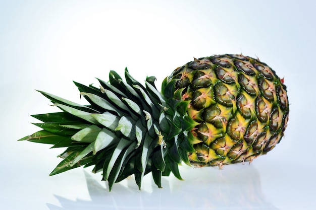 A fresh green ripe pineapple on a white background big size\
high resolution