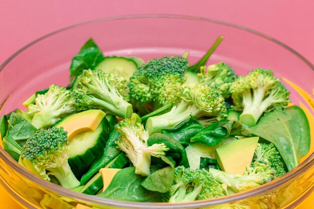 Fresh green salad of avocado broccoli spinach and cucumber for body detoxification