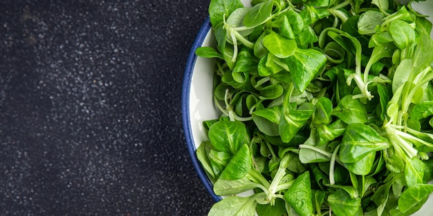fresh green salad mache leaves healthy meal food snack on the table copy space food background 