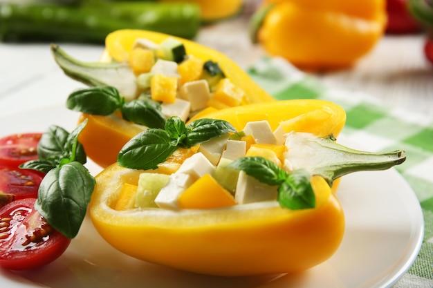 Fresh green salad in pepper on table close up