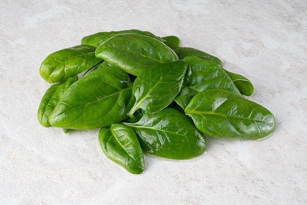 Fresh green spinach leaves, healthy food, copy space.