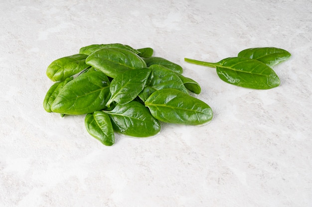 Fresh green spinach leaves, healthy food, copy space.