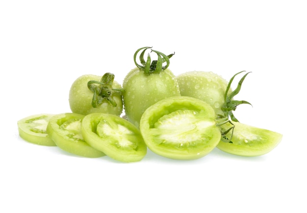 Fresh green tomatoes, whole and sliced