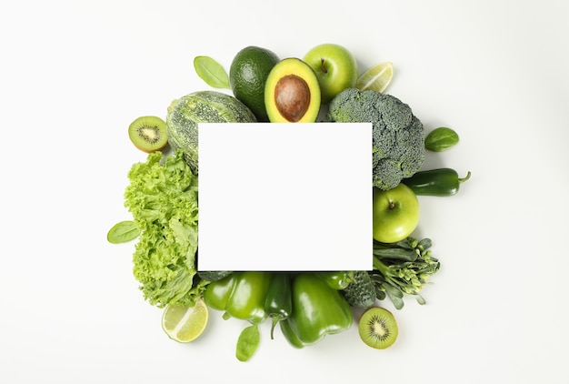 Fresh green vegetables on white background