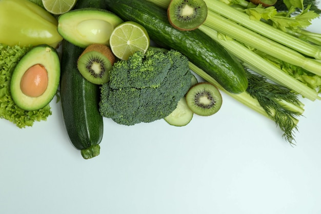 Fresh green vegetables on white background