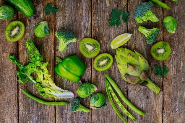 Fresh green vegetables on a wood table.