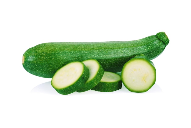 Fresh green zucchini with slice isolated on white background