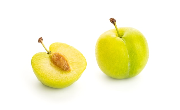 Fresh Greengage isolated on white background. Green yellow plum. Prunus domestica subsp. italica