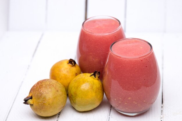 Fresh guava juice on a white background.