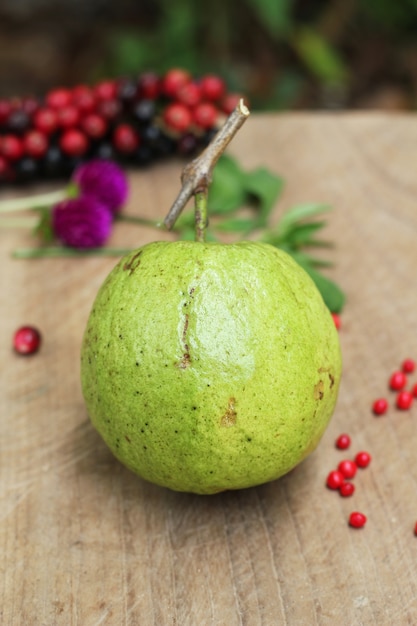 fresh guavas on wooden table 