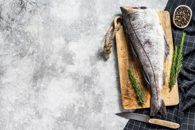 Fresh haddock fish carcass on the cutting board