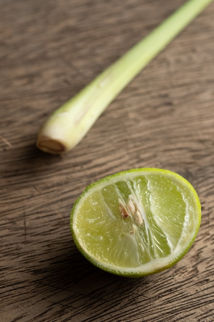 Fresh half lime on wooden board