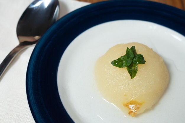 Fresh half Pears Served with sweet syrup and mint leaves.