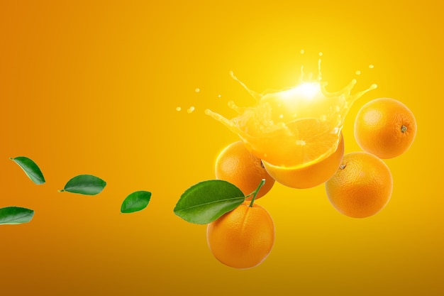 Fresh half of ripe Orange fruit splashing