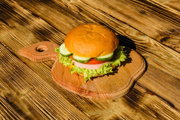 Fresh hamburger on the rustic wooden table