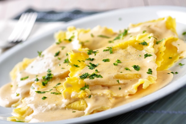 Fresh Handmade Ravioli with Cream on a Plate