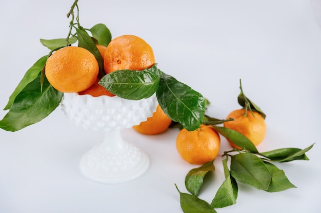 Fresh harvest of mandarin, tangerine with green leaves