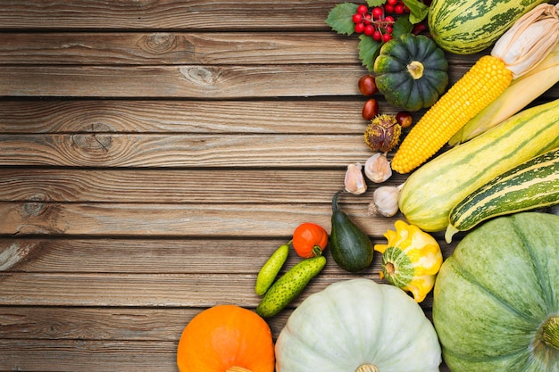 Fresh harvest vegetables on wooden background flat lay natural light