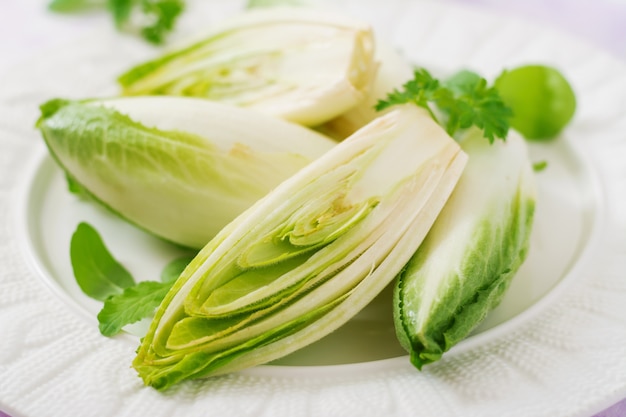 Fresh and healthy Chicory (witloof) Salad on a plate. Dietary menu. Healthy food.