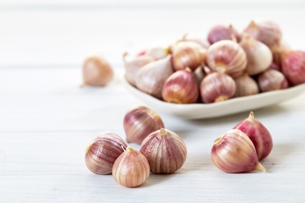 Fresh healthy garlic on white table