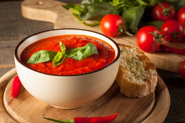 Fresh, healthy tomato soup with basil, pepper, garlic, tomatoes and bread. Spanish gazpacho soup.