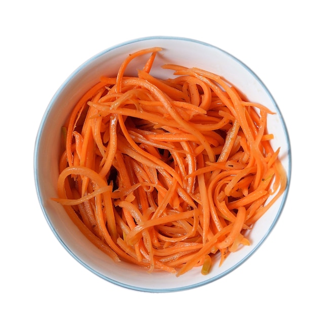 Fresh and healthy veggies korean salad grated carrots in a white plate