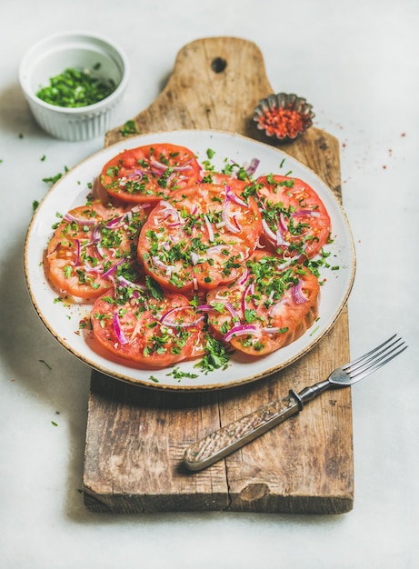 Fresh heirloom tomato parsley and onion salad Clean eating food