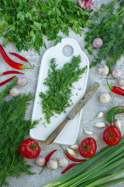 Fresh herbs on a gray background, Parsley, garlic, onions and dill