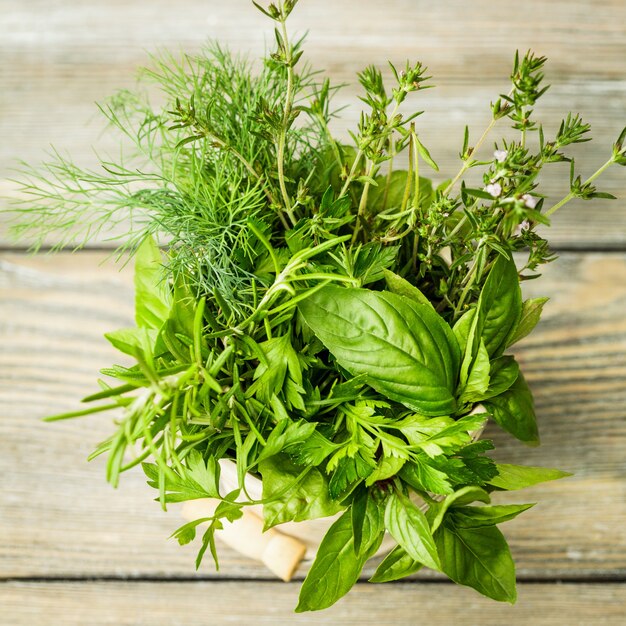 Fresh herbs outdoor on the wooden table