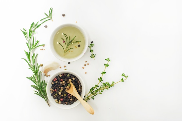 Fresh herbs and spices on white