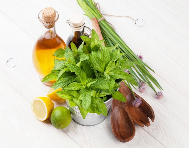 Fresh herbs and spices on wooden table