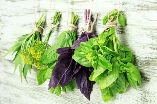 Fresh herbs on wooden background