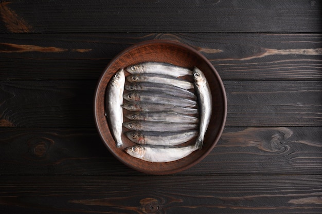 Fresh herring on rustic wooden background close up shot