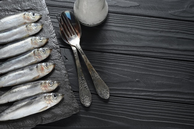 Fresh herring on rustic wooden background close up shot