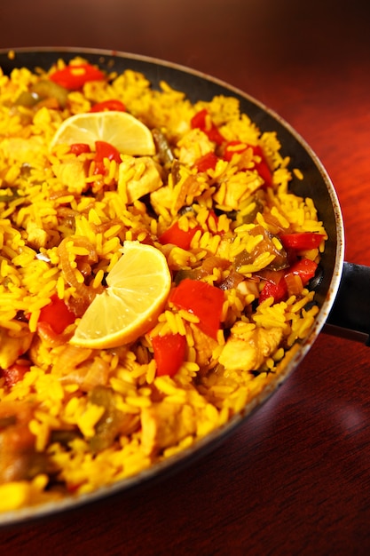 A fresh home made paella served on a frying pan